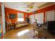 Comfortable home office space featuring hardwood floors, a ceiling fan, and plenty of natural light at 112 13Th Ave, Indian Rocks Beach, FL 33785