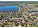 Panoramic aerial view highlighting the home, surrounding homes, neighborhood, and large lake nearby at 12304 Silton Peace Dr, Riverview, FL 33579
