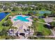 Aerial view of community pool, tennis court, playground, and clubhouse at 12304 Silton Peace Dr, Riverview, FL 33579