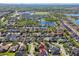 Extensive aerial view showcasing the surrounding community, nearby lakes, and cityscape at 12304 Silton Peace Dr, Riverview, FL 33579