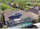 Aerial view of a home showcasing a screened-in pool and spa in a serene backyard setting at 12304 Silton Peace Dr, Riverview, FL 33579