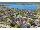 Aerial view of a home and its neighborhood close to a large lake with lots of surrounding homes at 12304 Silton Peace Dr, Riverview, FL 33579