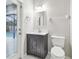 Bathroom with a dark vanity, modern fixtures, and easy access to the backyard pool at 12304 Silton Peace Dr, Riverview, FL 33579