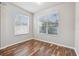Cozy bedroom with hardwood floors, natural light, and neutral paint at 12304 Silton Peace Dr, Riverview, FL 33579