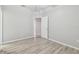 Neutral bedroom featuring hard surface floors and an open doorway at 12304 Silton Peace Dr, Riverview, FL 33579