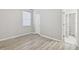 Bright bedroom with modern flooring and light walls at 12304 Silton Peace Dr, Riverview, FL 33579