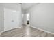 Bedroom with hard surface floors, a closet, and an entry to a bathroom at 12304 Silton Peace Dr, Riverview, FL 33579