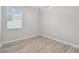 Well-lit bedroom with modern flooring and a bright window at 12304 Silton Peace Dr, Riverview, FL 33579