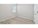 Bright bedroom with light-colored walls and wood-look flooring at 12304 Silton Peace Dr, Riverview, FL 33579