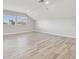 Spacious bonus room with vaulted ceiling, recessed lights and new wood flooring at 12304 Silton Peace Dr, Riverview, FL 33579