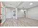 Spacious living room features hardwood floors, neutral paint, and classic architectural columns at 12304 Silton Peace Dr, Riverview, FL 33579