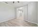 Open floor plan with hardwood floors, neutral paint, and elegant archway at 12304 Silton Peace Dr, Riverview, FL 33579
