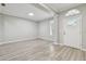 Spacious living room features hardwood floors, neutral paint, and plenty of natural light at 12304 Silton Peace Dr, Riverview, FL 33579