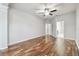 Large main bedroom features hardwood floors, neutral paint, and access to the main bath at 12304 Silton Peace Dr, Riverview, FL 33579