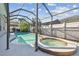 Inviting pool and spa enclosed within a screened lanai for year-round enjoyment at 12304 Silton Peace Dr, Riverview, FL 33579