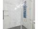 Modern shower with stylish tile and a deluxe shower panel with multiple functions at 12304 Silton Peace Dr, Riverview, FL 33579