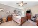 Cozy bedroom featuring a comfortable bed, dresser, and a large window at 14205 Stockwell Ln, Ruskin, FL 33573