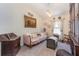 Cozy living room with vintage furniture and natural light from the window at 14205 Stockwell Ln, Ruskin, FL 33573