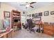 Functional office space with a wooden desk, ample storage, and natural light at 14205 Stockwell Ln, Ruskin, FL 33573