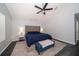 Calm bedroom featuring a vaulted ceiling with ceiling fan, neutral walls, and ample natural light at 2206 Green Oaks Ln, Tampa, FL 33612