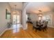 Bright dining room featuring hardwood floors and elegant lighting fixtures at 2206 Green Oaks Ln, Tampa, FL 33612