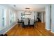 Elegant dining room with hardwood floors, stylish lighting, and ample natural light at 2206 Green Oaks Ln, Tampa, FL 33612