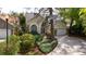 Charming home features a well-manicured lawn, mature landscaping, and a welcoming entrance, enhancing its curb appeal at 2206 Green Oaks Ln, Tampa, FL 33612
