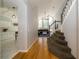 Inviting hallway with hardwood floors, leading to the living room and kitchen at 2206 Green Oaks Ln, Tampa, FL 33612