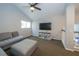 Comfortable upstairs living room with vaulted ceilings, plush seating, and a wall-mounted TV at 2206 Green Oaks Ln, Tampa, FL 33612
