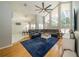 Open-concept living room with hardwood floors, tall windows, and lots of natural light at 2206 Green Oaks Ln, Tampa, FL 33612