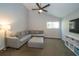 Cozy living room with vaulted ceilings, plush seating, and a wall-mounted TV for entertainment at 2206 Green Oaks Ln, Tampa, FL 33612