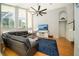 Spacious living room with vaulted ceilings, large windows, and comfortable seating area at 2206 Green Oaks Ln, Tampa, FL 33612