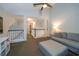 Cozy living room featuring vaulted ceilings, ceiling fan, and comfortable seating area at 2206 Green Oaks Ln, Tampa, FL 33612