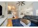 Open concept living room with high ceilings, hardwood floors, and seamless flow to kitchen at 2206 Green Oaks Ln, Tampa, FL 33612