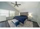 Cozy main bedroom featuring a large bed, soft carpet, and lots of natural light at 2206 Green Oaks Ln, Tampa, FL 33612