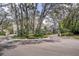 A cul-de-sac showcasing landscaped yards, mature trees, and well-maintained homes in an inviting neighborhood setting at 2206 Green Oaks Ln, Tampa, FL 33612
