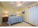 Inviting bedroom with coastal decor, featuring a comfortable bed and ample natural light for a serene retreat at 2211 Belleair Rd # D12, Clearwater, FL 33764