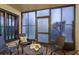 Enclosed sunroom with comfortable seating, perfect for relaxing and enjoying the outdoors at 2211 Belleair Rd # D12, Clearwater, FL 33764