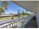 Enjoy outdoor living on this covered balcony with neighborhood views and ample space for relaxing and entertaining at 2605 Hibiscus W Dr, Belleair Beach, FL 33786