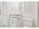 Bright bathroom features white vanity with granite counters and coordinated decor at 29488 Ginnetto Dr, Wesley Chapel, FL 33543