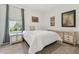 Cozy bedroom featuring neutral tones, carpeted floors, and a window with natural light at 29488 Ginnetto Dr, Wesley Chapel, FL 33543