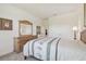 Well-lit bedroom boasts a comfortable bed and classic wooden furniture at 29488 Ginnetto Dr, Wesley Chapel, FL 33543
