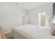 Comfortable bedroom with neutral decor, closet space, and an ensuite bathroom at 29488 Ginnetto Dr, Wesley Chapel, FL 33543