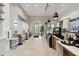 Charming cafe interior with modern lighting, cozy seating, and a stylish display case at 29488 Ginnetto Dr, Wesley Chapel, FL 33543