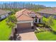 Beautiful single-Gathering home boasts lush landscaping and a brick paver driveway at 29488 Ginnetto Dr, Wesley Chapel, FL 33543