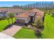 Beautifully landscaped single-Gathering home features a paver driveway and two-car garage at 29488 Ginnetto Dr, Wesley Chapel, FL 33543