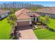 Attractive single-Gathering home with paver driveway, landscaping, and a two-car garage at 29488 Ginnetto Dr, Wesley Chapel, FL 33543