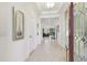 Spacious foyer with tile flooring, high ceilings, decorative trim, and an open view into the living areas at 29488 Ginnetto Dr, Wesley Chapel, FL 33543