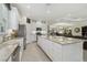 Bright and open kitchen with a center island, stainless appliances, and ample storage space at 29488 Ginnetto Dr, Wesley Chapel, FL 33543