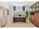 Office with large desk and built in curio cabinet at 29488 Ginnetto Dr, Wesley Chapel, FL 33543